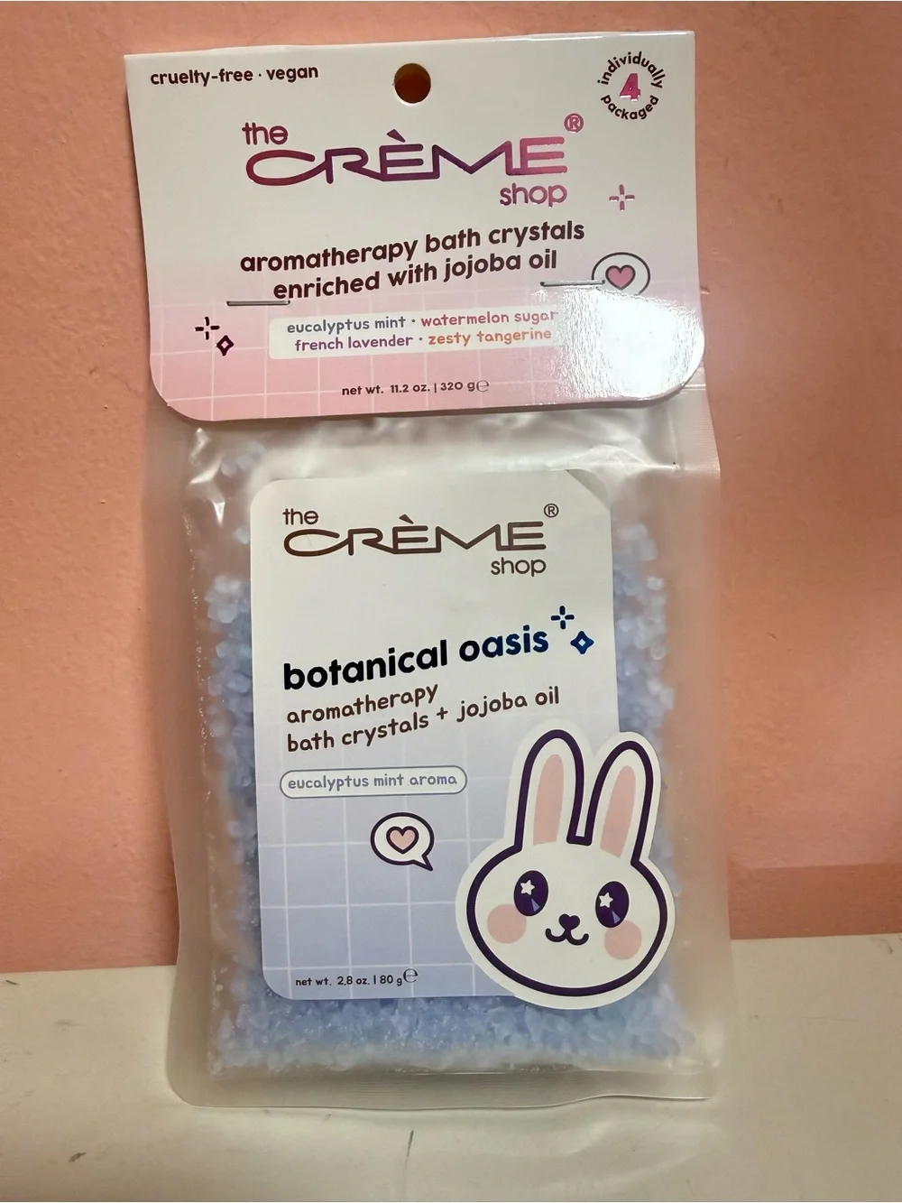 The Crème Shop brand aromatherapy bath crystals in the 